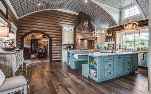country kitchen with exposed round log walls and wood floor curved ceiling